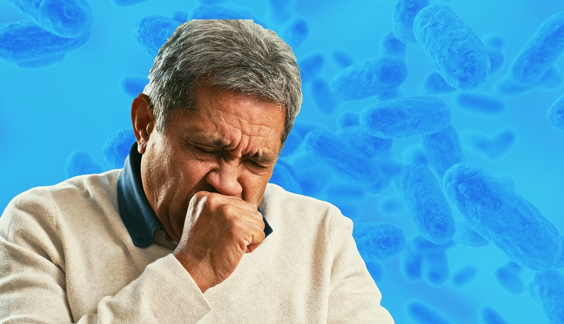 A senior man with whooping cough, depicted in a moment of coughing and sneezing, showcasing his struggle with illness.